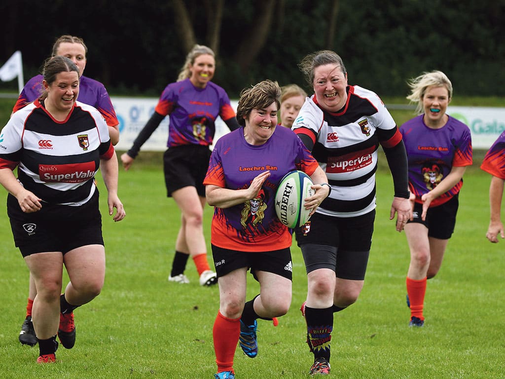 Ladies Jesters Captain Fiona Riney running with ball